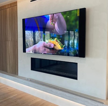 High End TV over fireplace